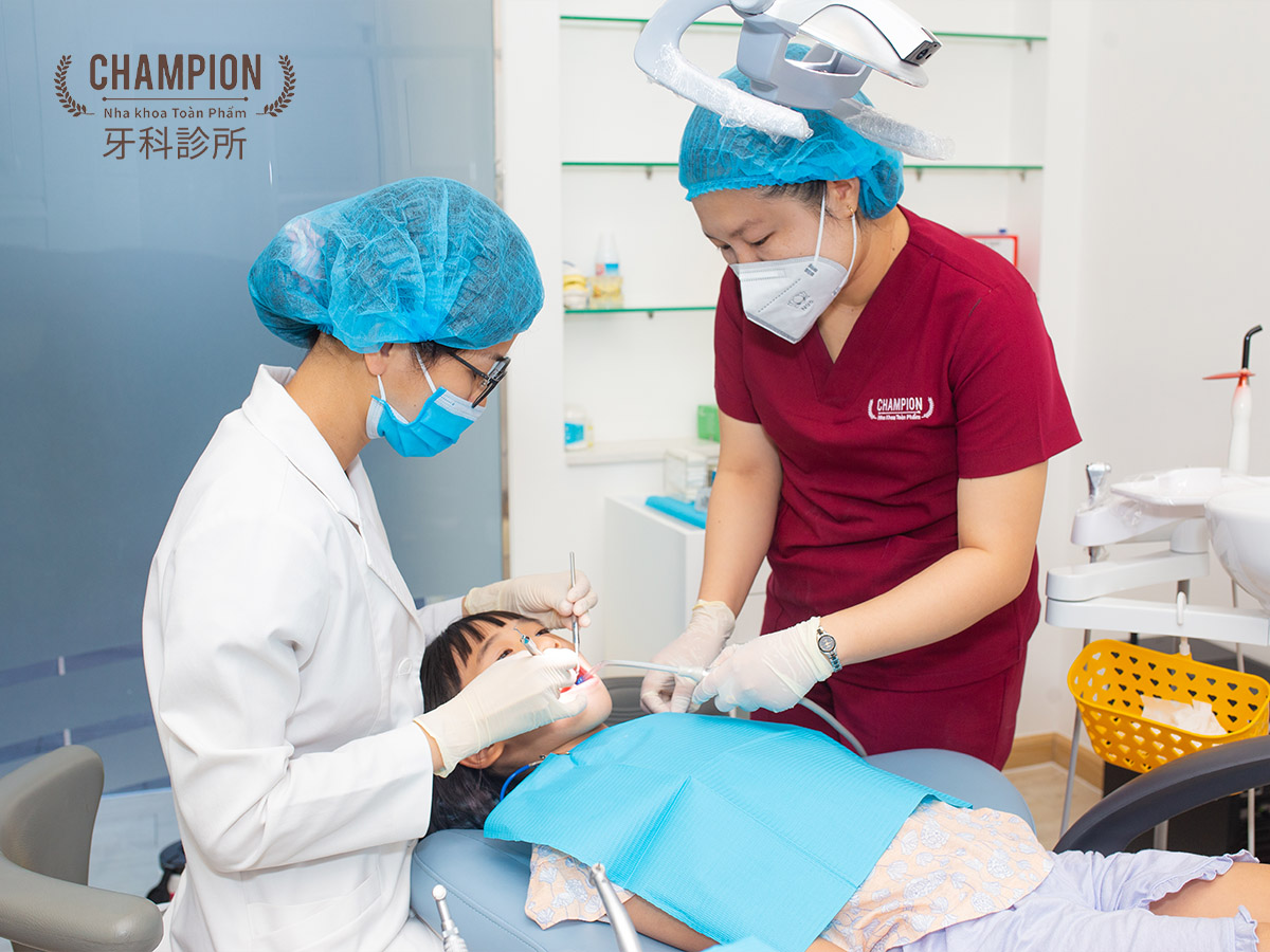 Dentist treatment for patient at Champion dental clinic